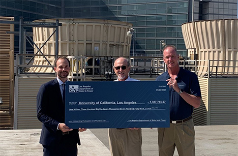 UCLA staff holding giant check from LADWP 