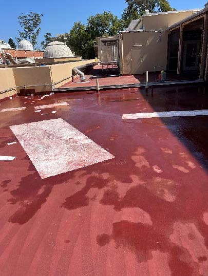 red roof with areas of ponding water
