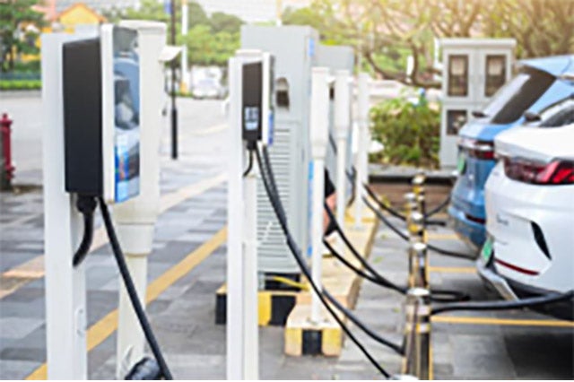 A row of EV vehicles being charged