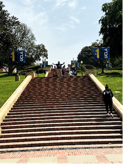 man walking up outdoor stairs