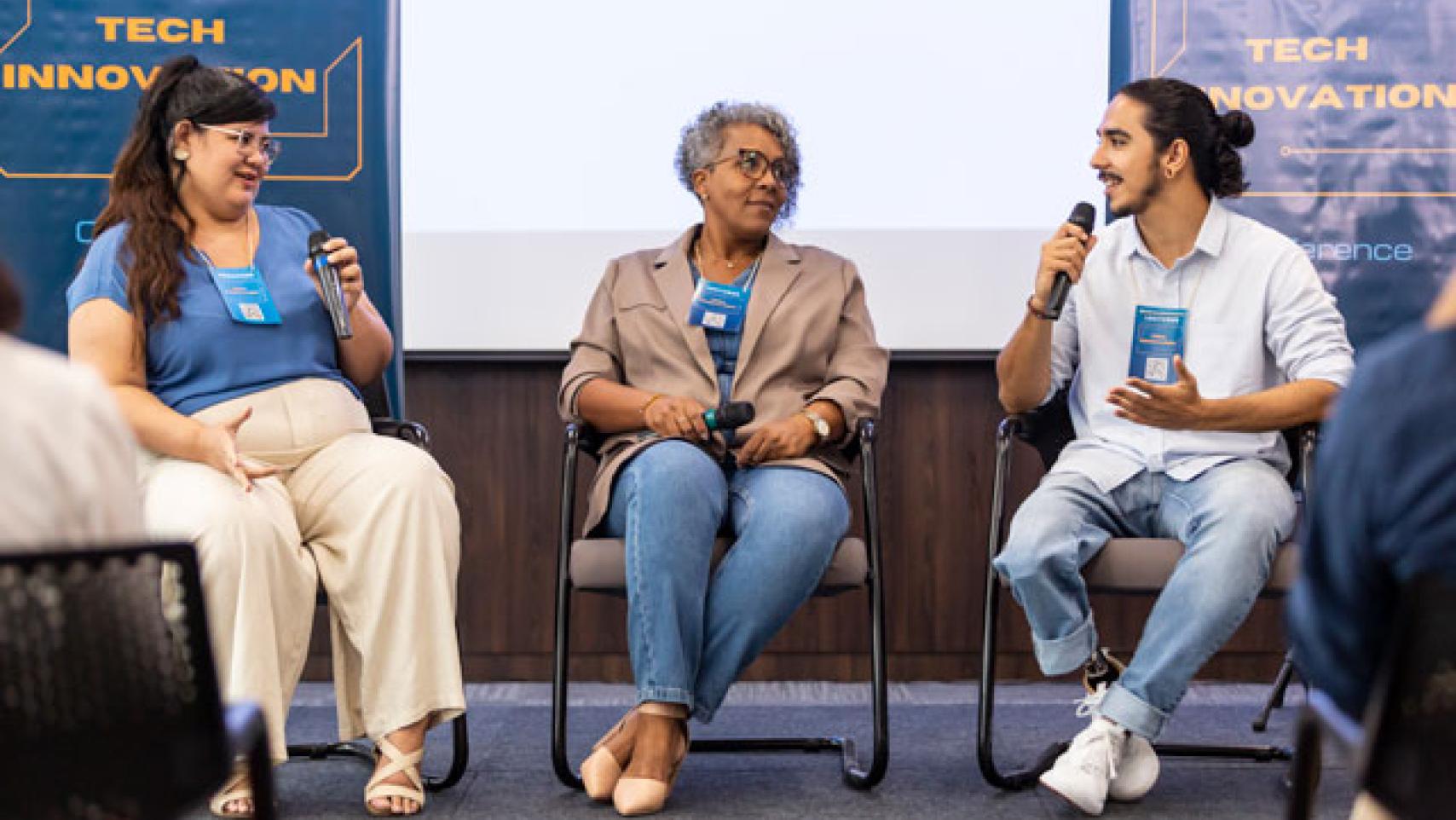 a group of attendees having a discussion at a conference