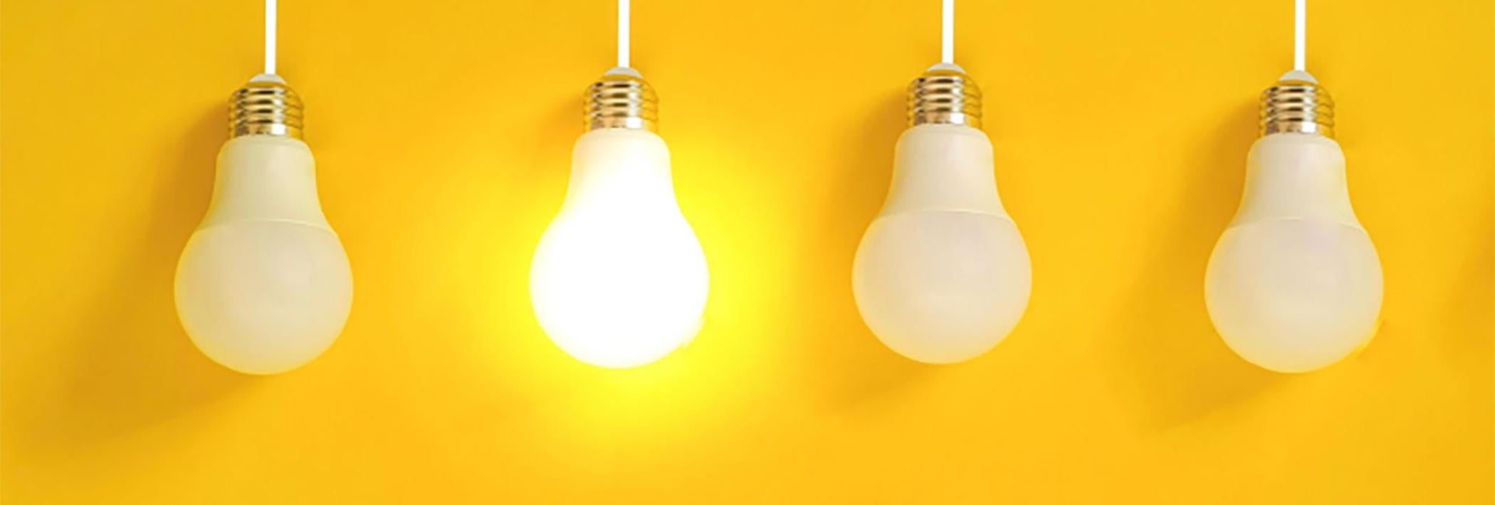 a row of led bulbs - one of them glowing brightly