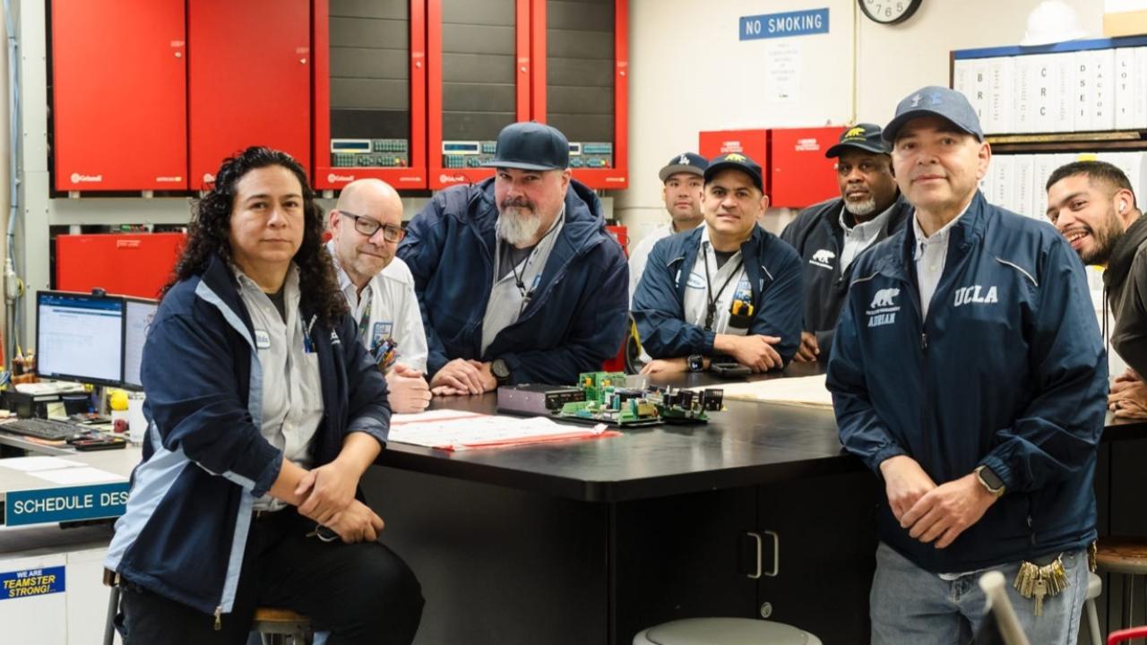 team of nine electricians in the facilities electrical shop