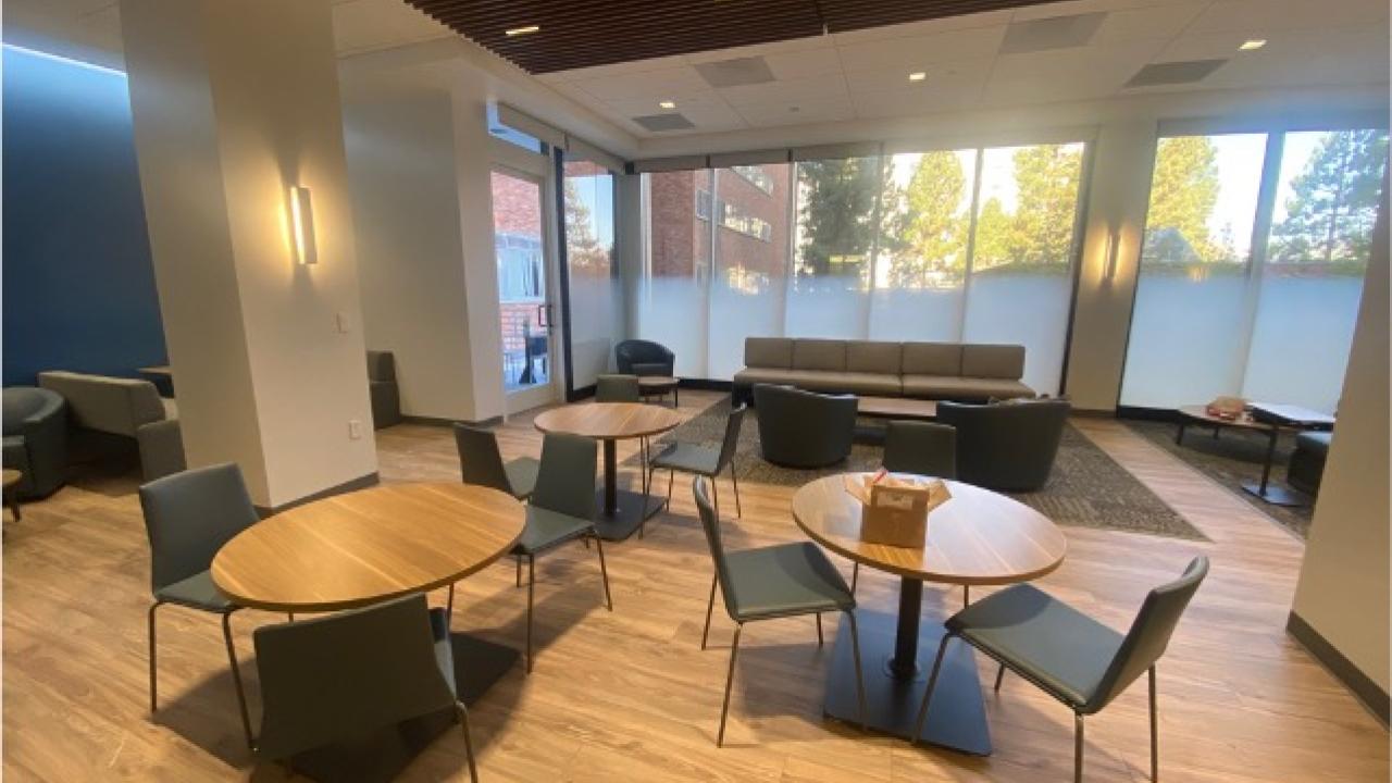 updated seating area with tables and chairs in public health building