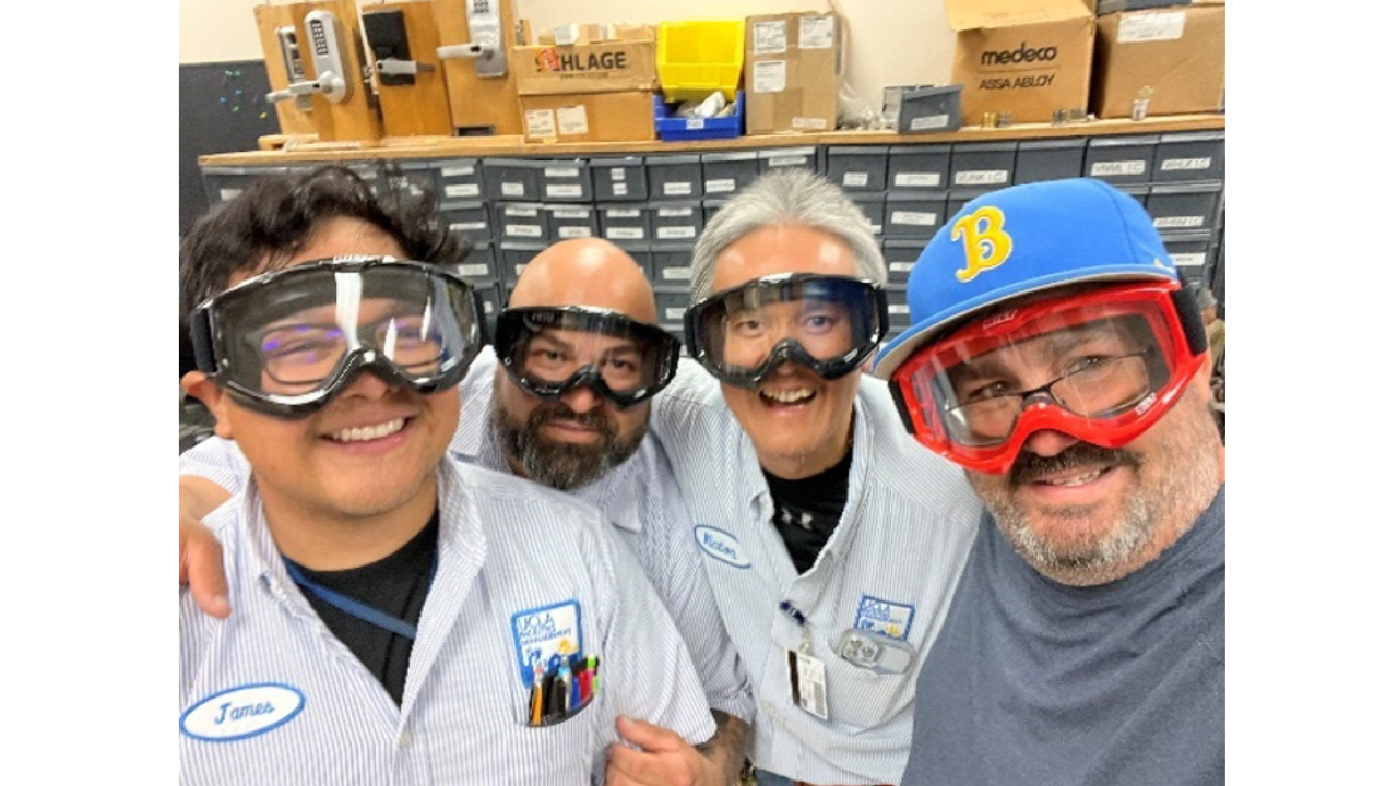 four men from the hardware shop wearing goggles