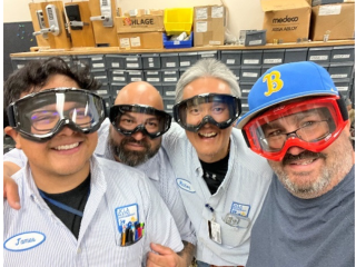 four men from the hardware shop wearing goggles