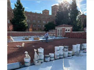 man working on a roof